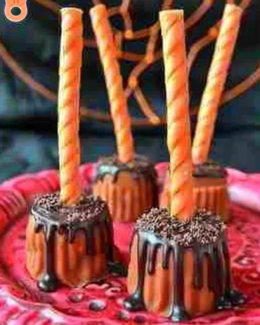 A variety of spooky and delicious Halloween treats displayed on a festive table