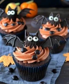Bat Cupcake 2 Delicious bat cupcake decorated for Halloween with chocolate frosting and candy accents.
