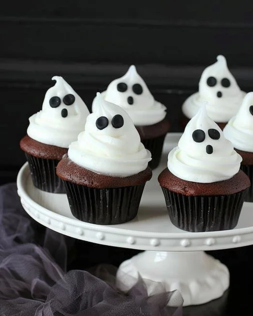 Easy Halloween Ghost Cupcakes 2 Easy Halloween ghost cupcakes decorated with spooky faces
