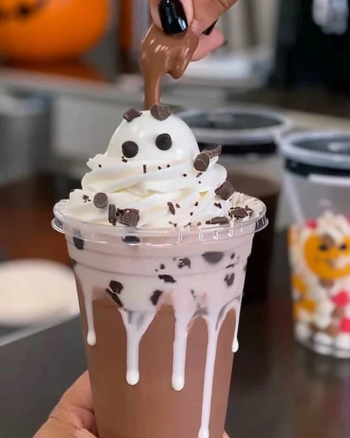 Ghost Chocolate Milk: Fun Fall Drinks for Kids & Halloween Movie Night Snacks 2 Glass of Ghost Chocolate Milk with Halloween decorations