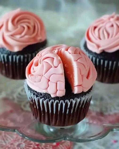 Decorated Halloween cupcakes with spooky designs and festive colors