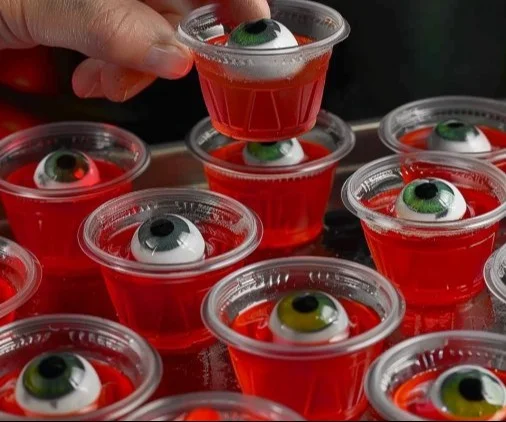 Halloween eyeball jello shots with gummy eyeballs for a spooky party treat