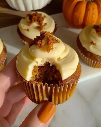 Homemade Pumpkin Cupcakes 2 Homemade pumpkin cupcakes topped with cream cheese frosting and spices
