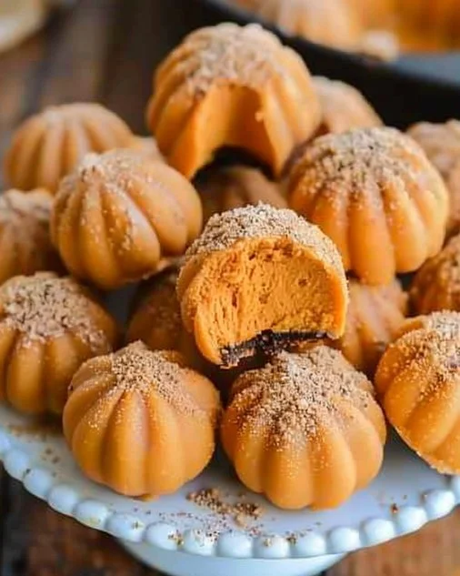 Pumpkin Cheesecake Truffles 2 Pumpkin Cheesecake Truffles featuring creamy pumpkin filling coated in chocolate