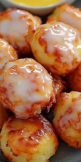 Delicious air fryer apple fritters served with a drizzle of icing