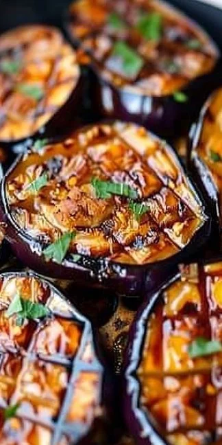 Crispy air fryer eggplant slices served with a dipping sauce.