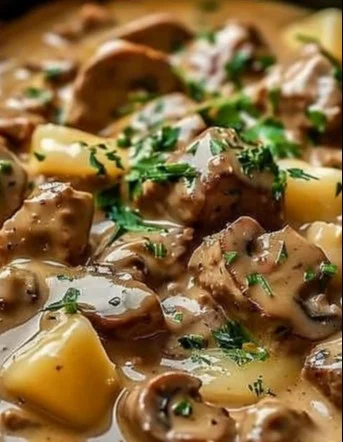 Delicious Beef Stroganoff served with egg noodles and garnished with parsley