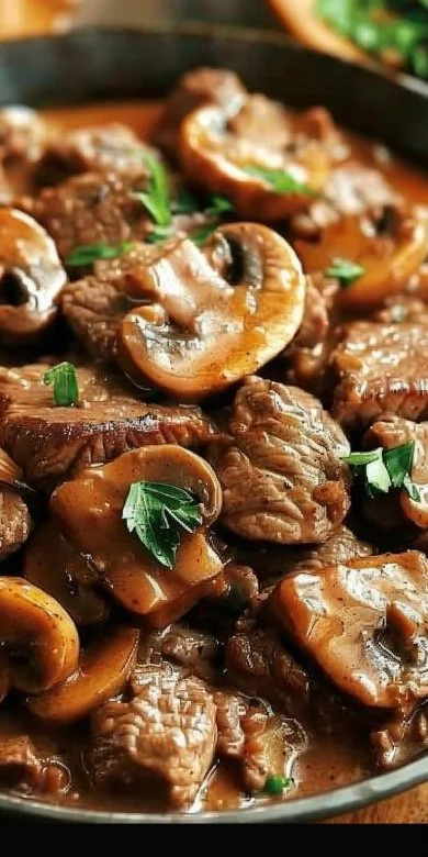 Best Beef Stroganoff 3 Deliciously creamy beef stroganoff served on noodles with mushrooms and herbs