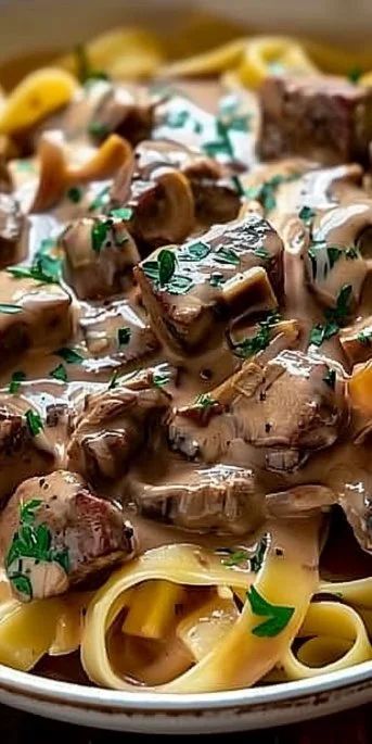 A plate of Classic Beef Stroganoff with tender beef and creamy sauce
