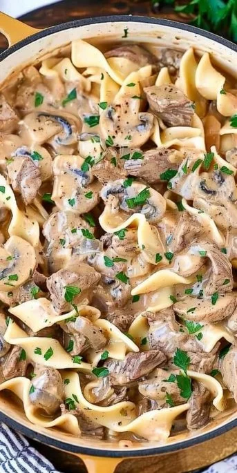 Creamy Beef Stroganoff 3 Creamy Beef Stroganoff served with pasta on a plate.