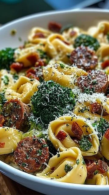 Creamy Garlic Parmesan Tortellini with Sausage and Broccoli 3 Creamy Garlic Parmesan Tortellini with Sausage and Broccoli in a bowl