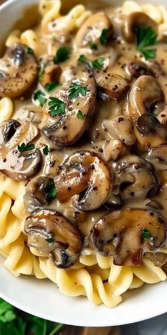 Creamy Vegetarian Mushroom Stroganoff 3 Creamy vegetarian mushroom stroganoff served in a bowl with herbs
