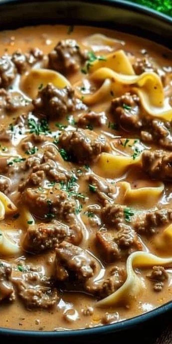 Bowl of easy ground beef stroganoff topped with fresh parsley