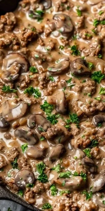 Easy hamburger beef stroganoff served in a bowl with creamy sauce and noodles.