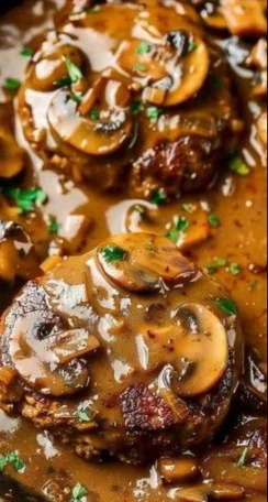Delicious Salisbury Steak with Mushroom Gravy served on a plate