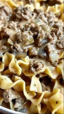 Ground Beef Stroganoff 3 Ground beef stroganoff served with pasta and fresh parsley garnish