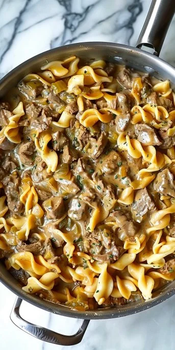 Lightened-up beef stroganoff served with noodles in a creamy sauce