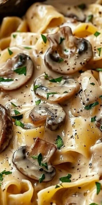 Mushroom Stroganoff Pasta 3 Delicious Mushroom Stroganoff Pasta served in a bowl with fresh herbs