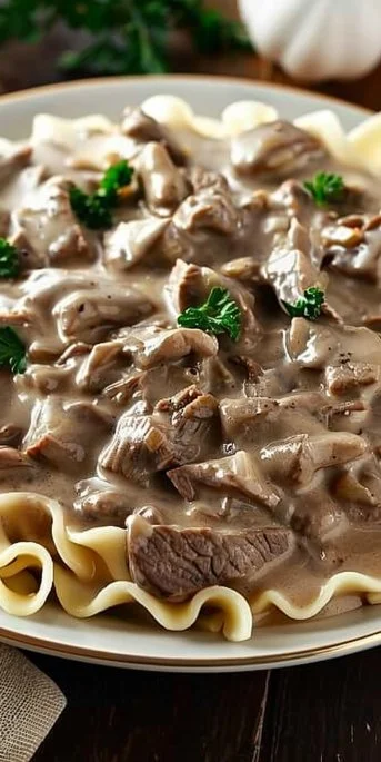 Delicious old fashioned beef stroganoff served with noodles and mushrooms