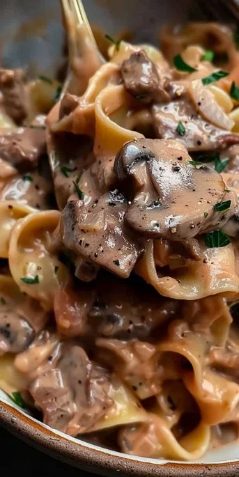 Delicious bowl of world's best beef stroganoff with mushrooms and creamy sauce