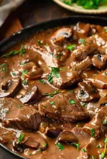 Delicious Beef Stroganoff served with egg noodles and garnished with parsley
