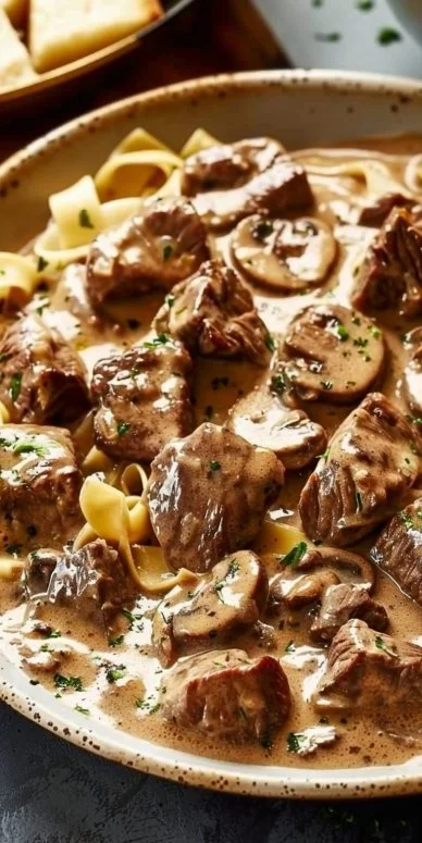 Plate of Gordon Ramsay's delicious Beef Stroganoff with mushrooms and noodles