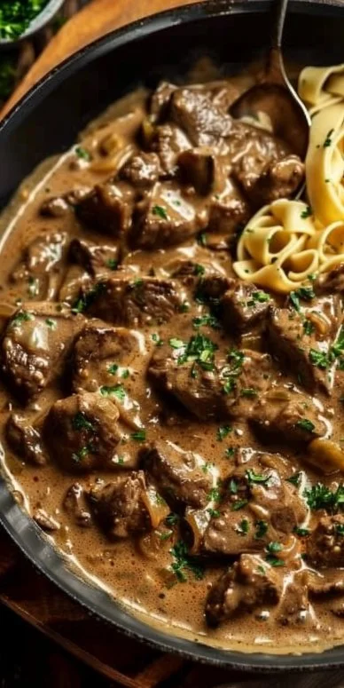 Gordon Ramsay's Beef Stroganoff 4 Gordon Ramsay's Beef Stroganoff served with noodles and garnished with parsley.