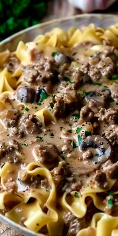 Delicious plate of Ground Beef Stroganoff served with pasta and garnished with parsley