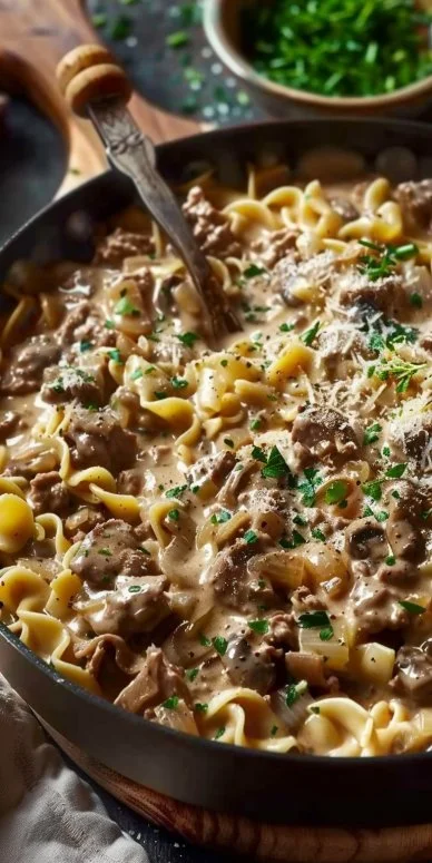 Ground Beef Stroganoff Recipe 4 Plate of homemade ground beef stroganoff with noodles and fresh herbs