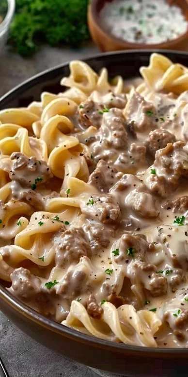 Homemade ground beef stroganoff served in a creamy sauce with noodles