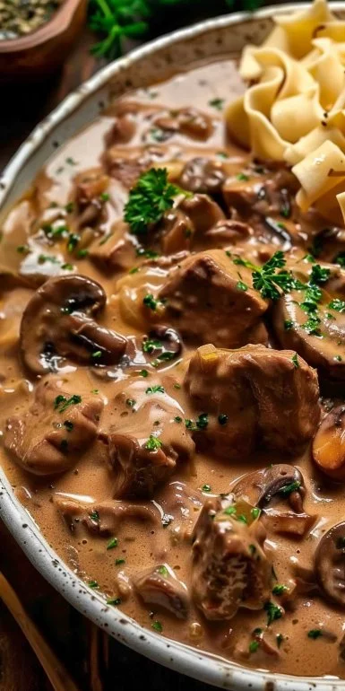 Delicious Beef Stroganoff served in rich mushroom gravy over egg noodles.
