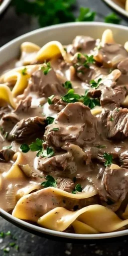 Bowl of delicious Crock Pot Beef Stroganoff with creamy sauce and mushrooms
