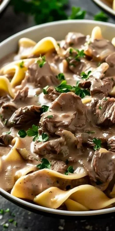 Bowl of delicious Crock Pot Beef Stroganoff with creamy sauce and mushrooms