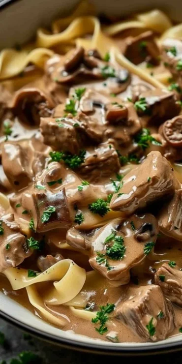 Delicious Crockpot Beef Stroganoff served with egg noodles