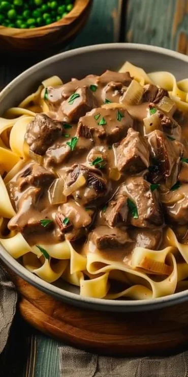 Crockpot Beef Stroganoff in a bowl with creamy sauce and tender beef slices
