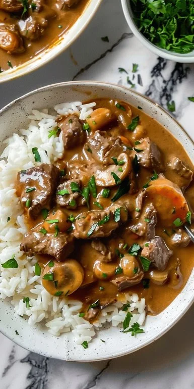Plate of easy beef stroganoff with rice garnished with parsley