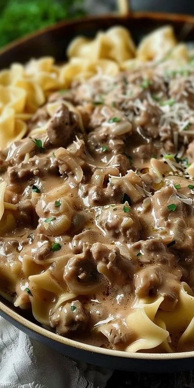 Delicious ground beef stroganoff served in a creamy sauce over pasta