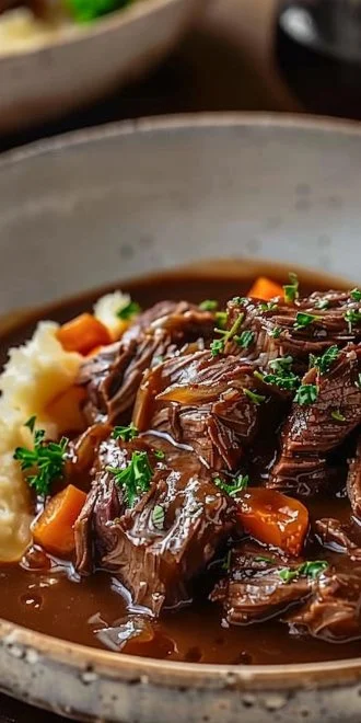 Slow cooker beef Manhattan served with creamy mashed potatoes.
