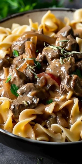 Homemade Crock Pot Beef Stroganoff 4 Homemade crock pot beef stroganoff served in a bowl with egg noodles