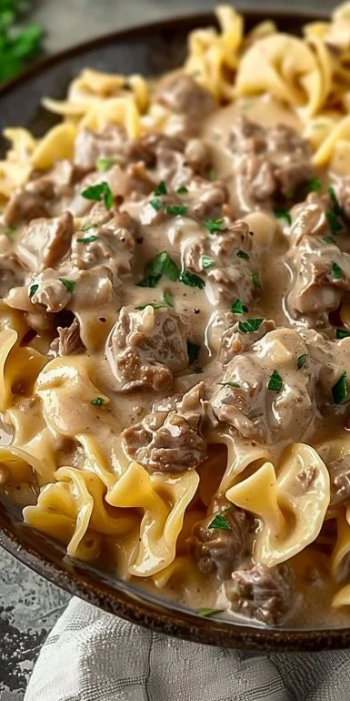 Homemade ground beef stroganoff served with creamy sauce and egg noodles