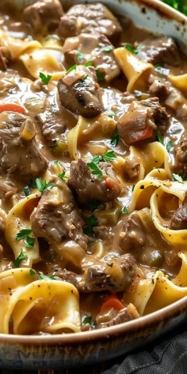 Delicious slow cooker beef stroganoff served with noodles