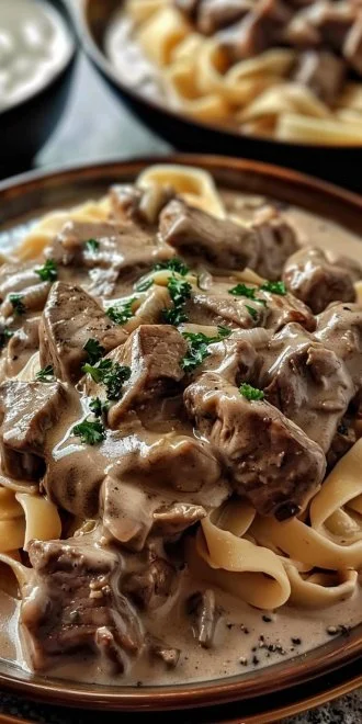 Delicious slow cooker beef stroganoff served with noodles